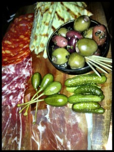 the platter of cold meats, olives and pitta