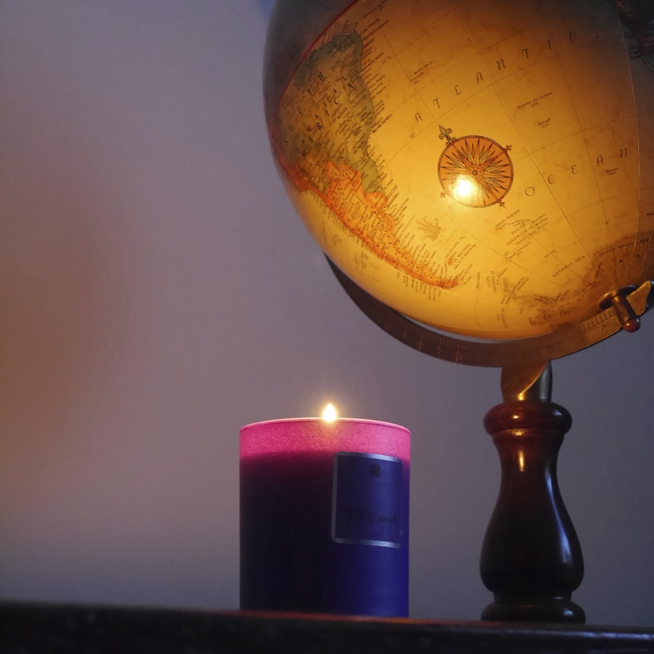 the candle glowing next to our globe