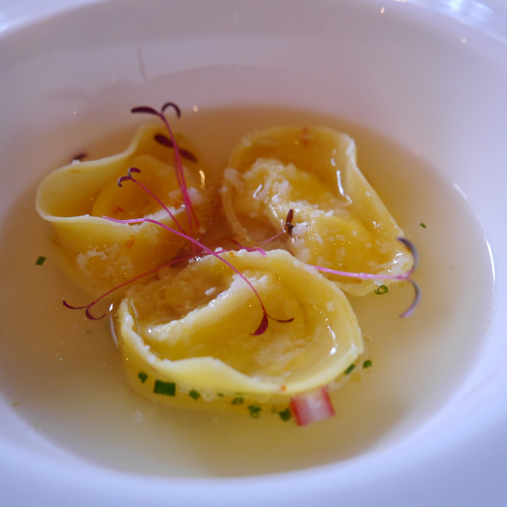 burrata and saffron tortellini with celeriac and lovage consommé 