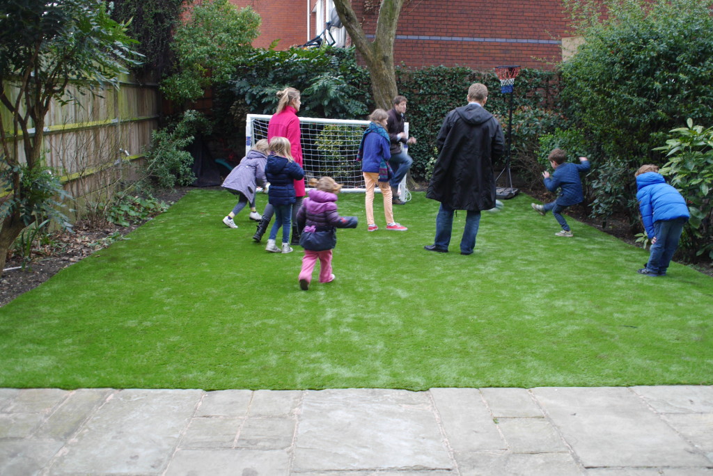 Small scores a goal in a family game on the new grass