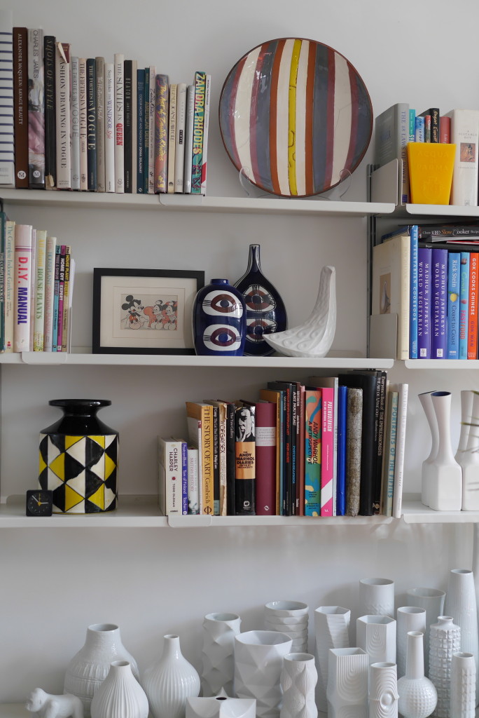 Eddie's colourful bookshelves with plenty of ceramics